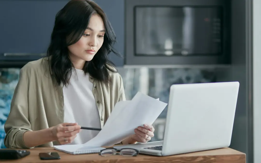 Person reviewing mortgage documents after an IVA.