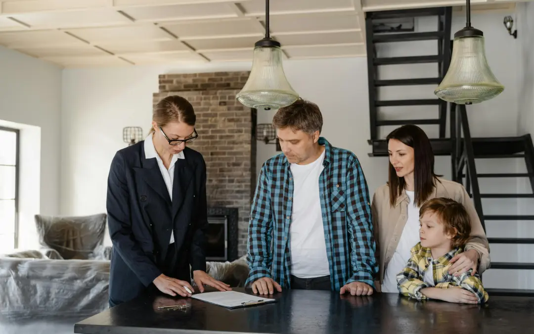 Mortgage adviser discussing remortgage options with a family at home.