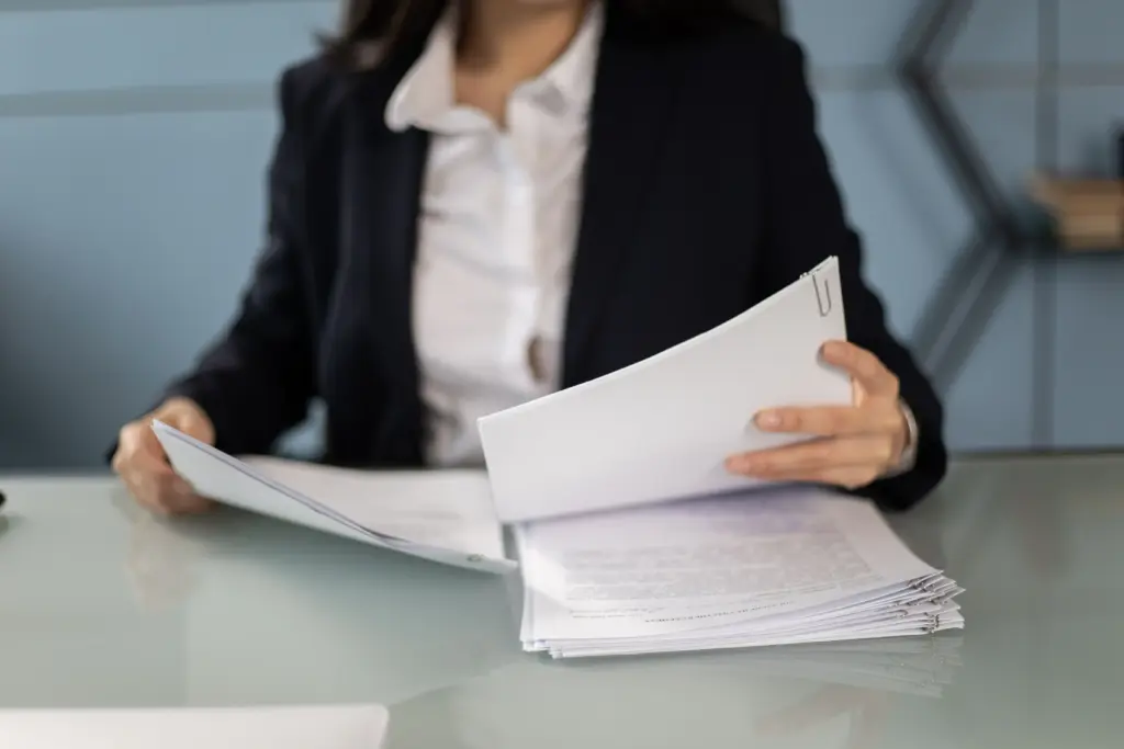 Professional reviewing documents for the remortgage legal process.